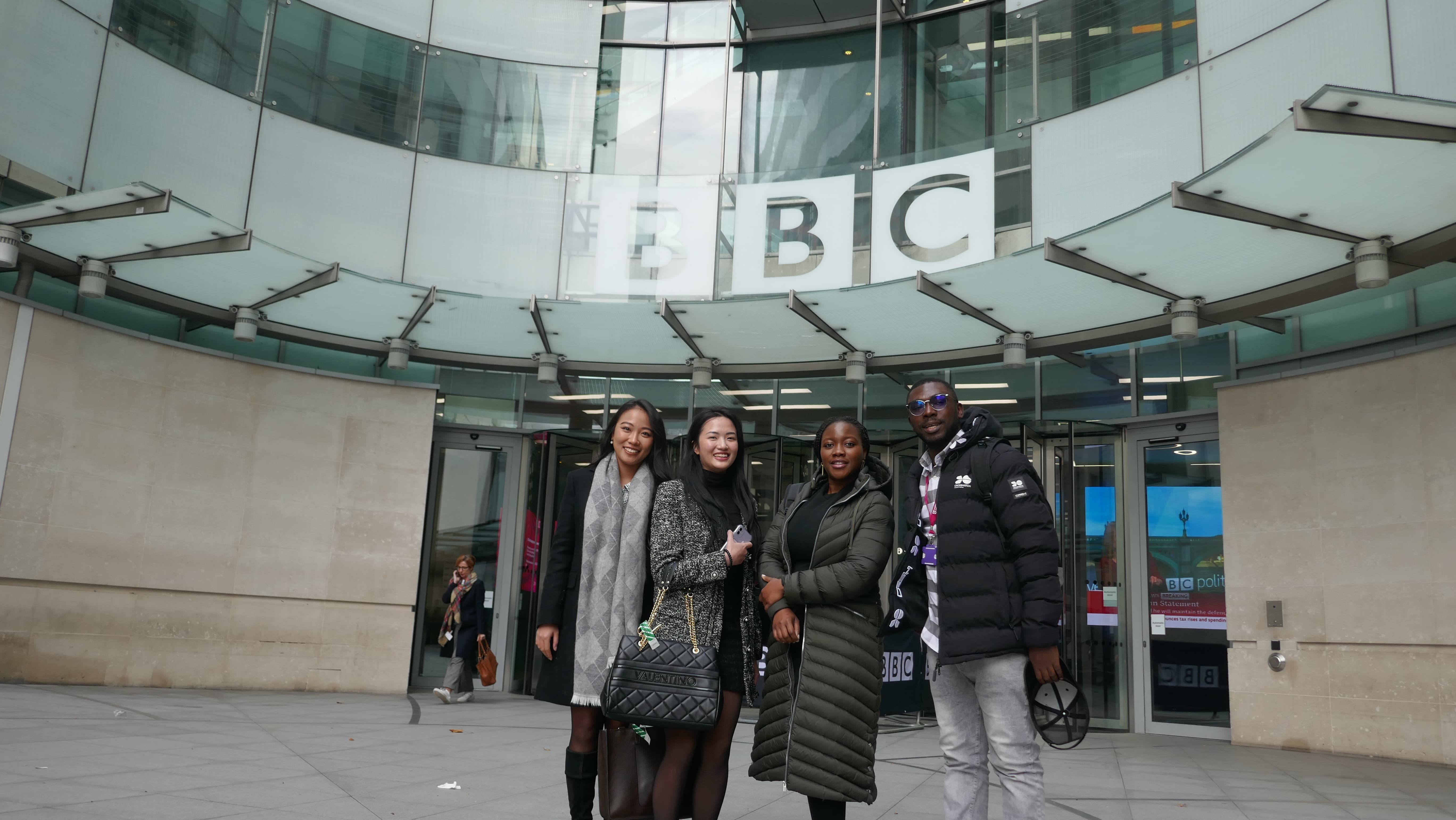 An image of four students from the Institute for Media and Creative Industries outside the BBC Broadcasting House